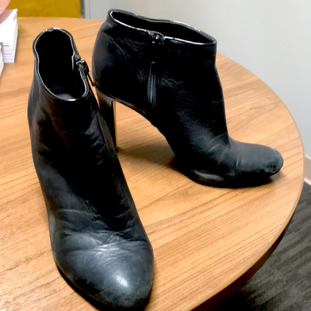 Supple black leather high heel zip up booties